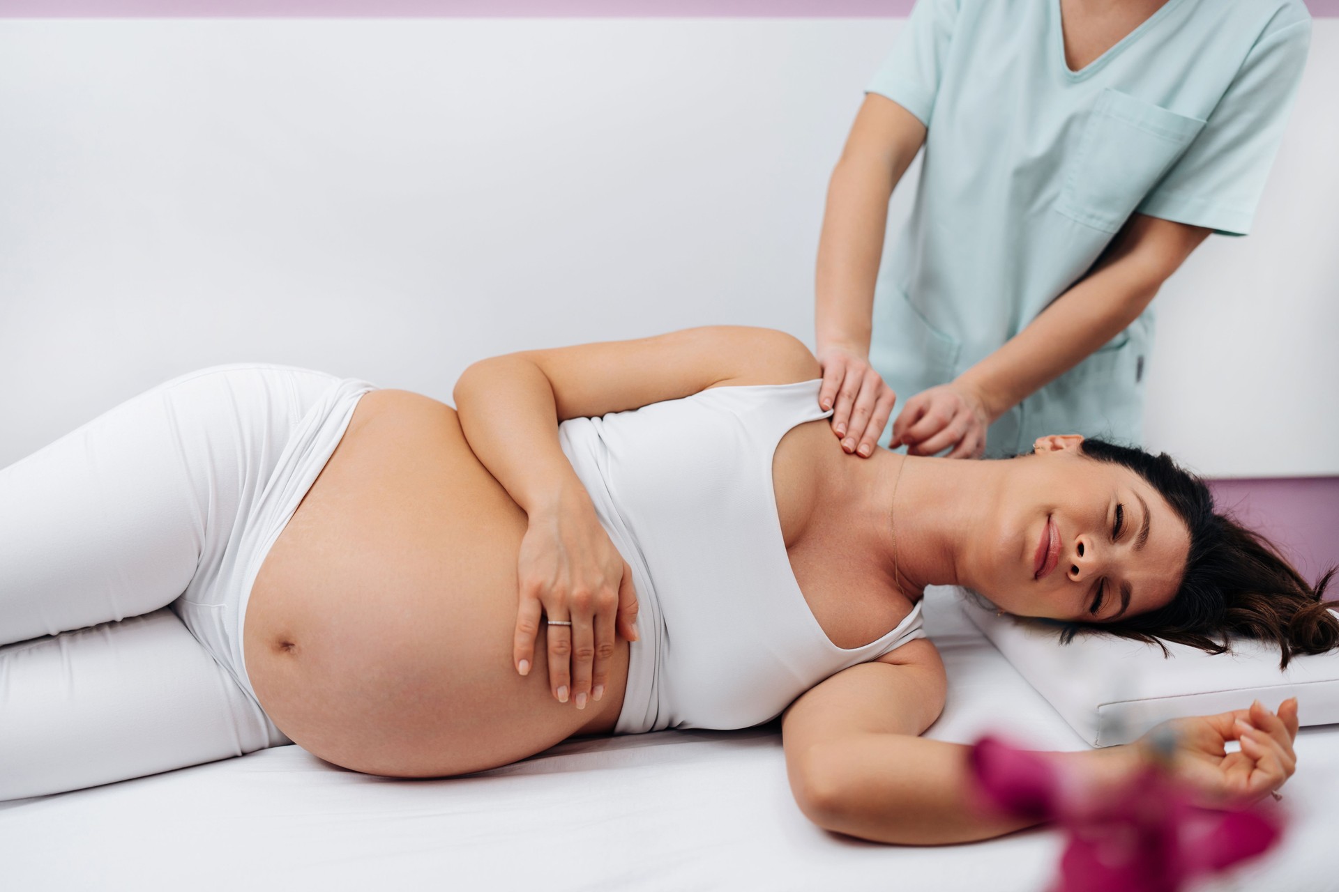 Pregnant woman at relaxing massage